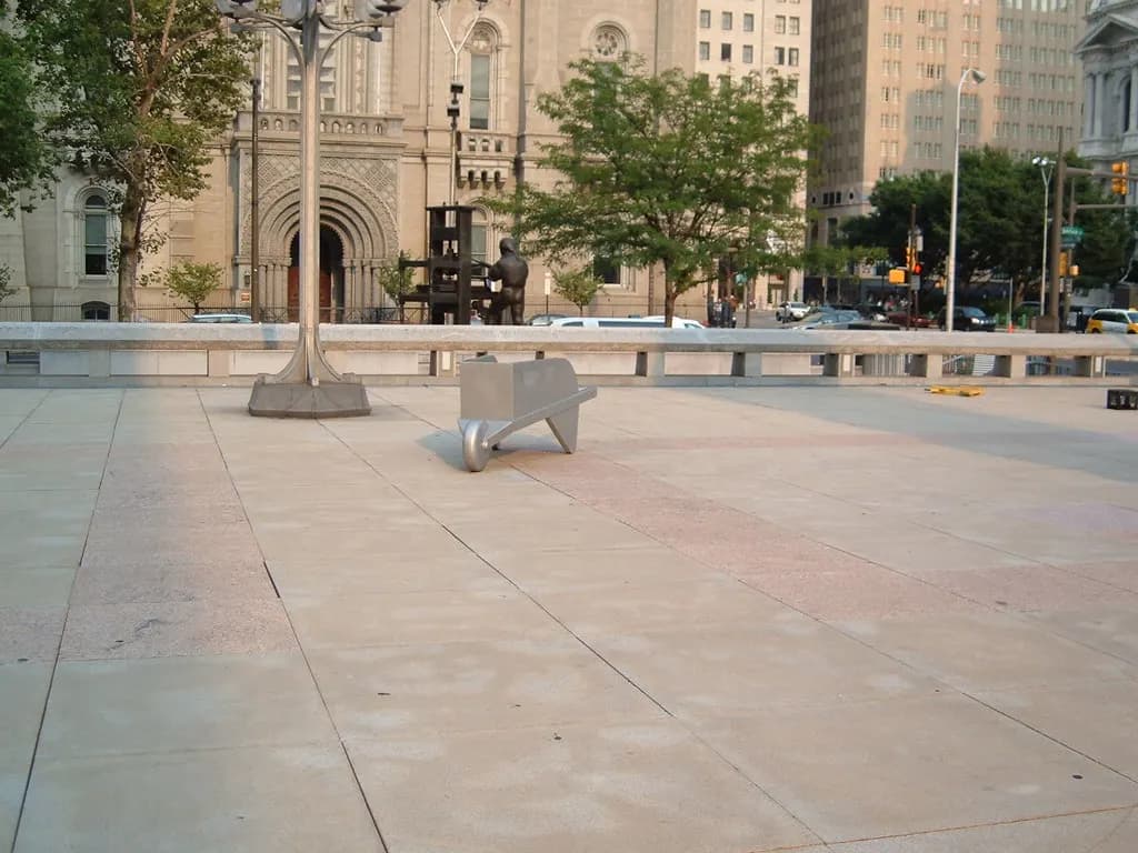 Plaza outside Philadelphia's Municipal Services Building with a giant board-game wheelbarrow sculpture