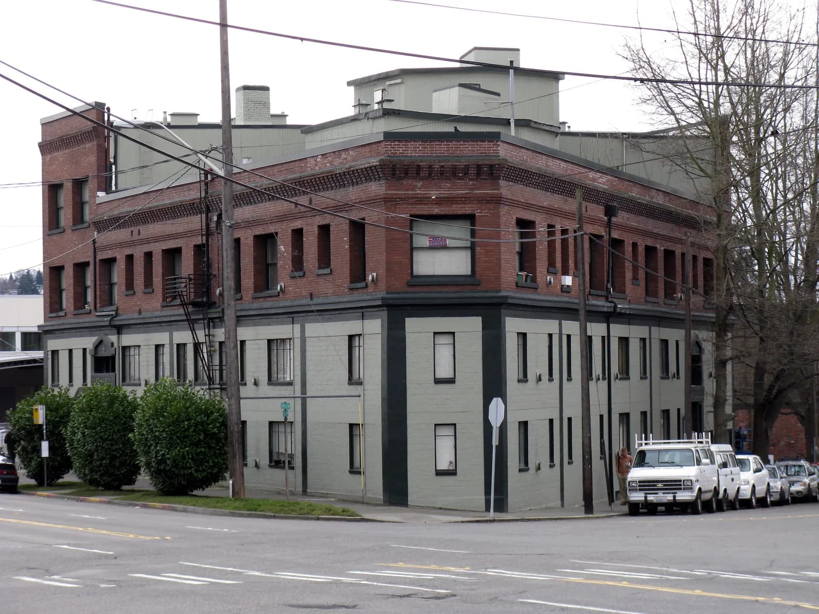 The brick Curtiss Block on Ballard Avenue in Seattle, with ground-floor shops