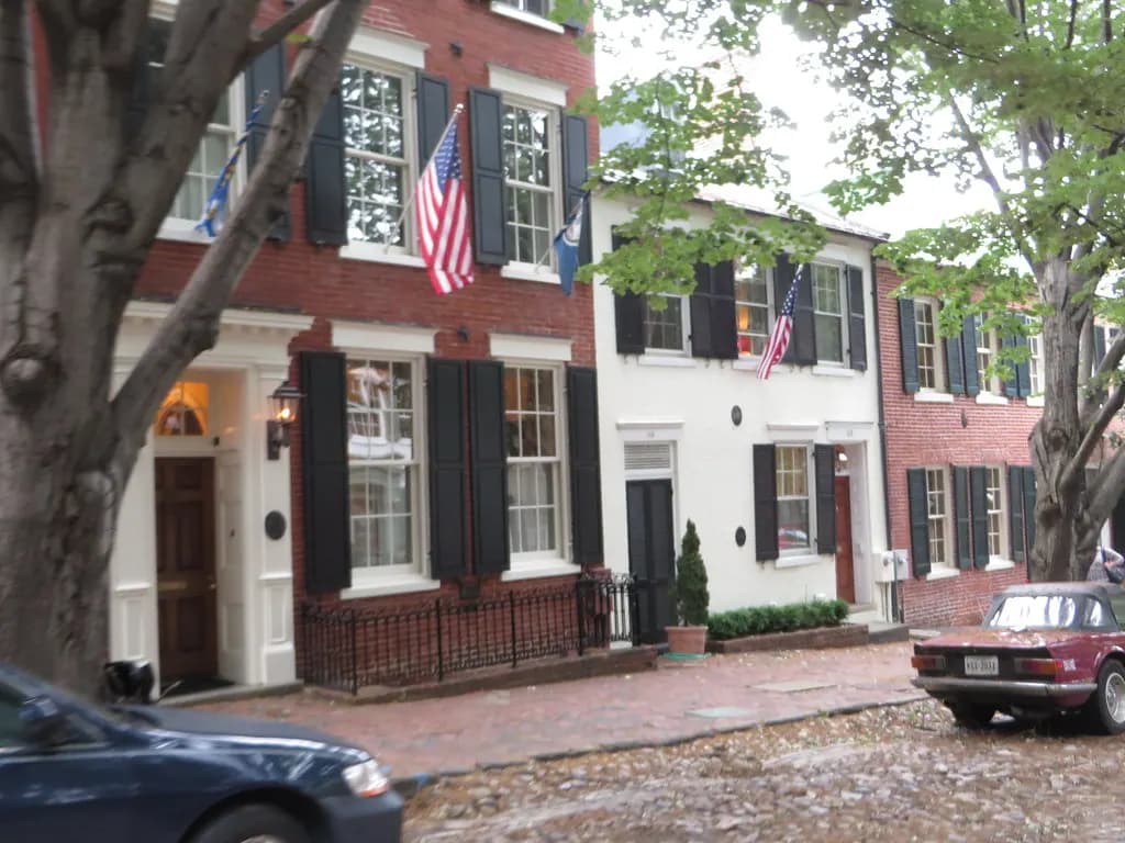 Brick row buildings and small storefronts on Prince Street in Old Town Alexandria, Virginia