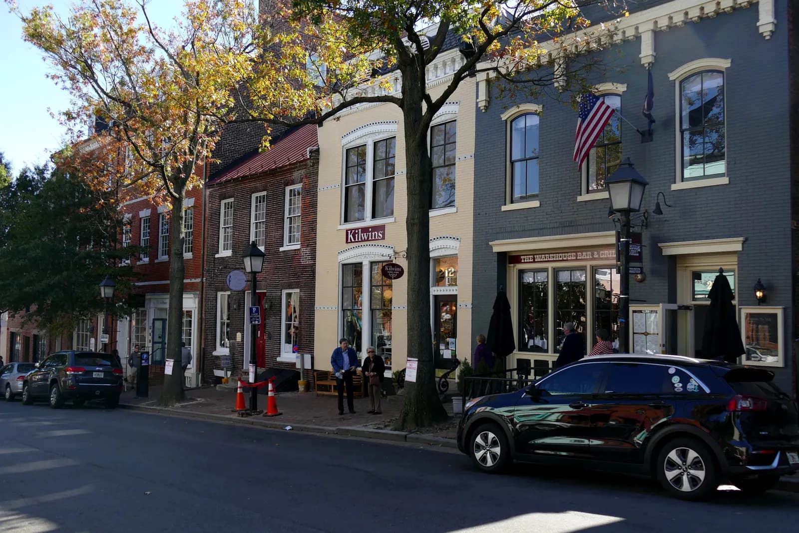 Brick shopfronts and street trees along King Street in Old Town Alexandria, Virginia