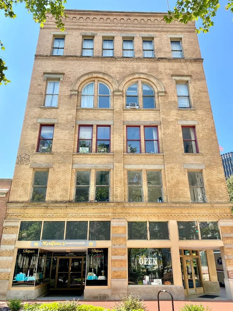 The Odd Fellows Building at Capitol and Lee Streets in downtown Charleston, West Virginia, with shops at street level