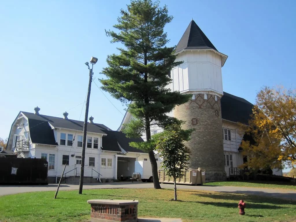 The University of Wisconsin Dairy Barn in Madison, with its brick silo tower, on an autumn day