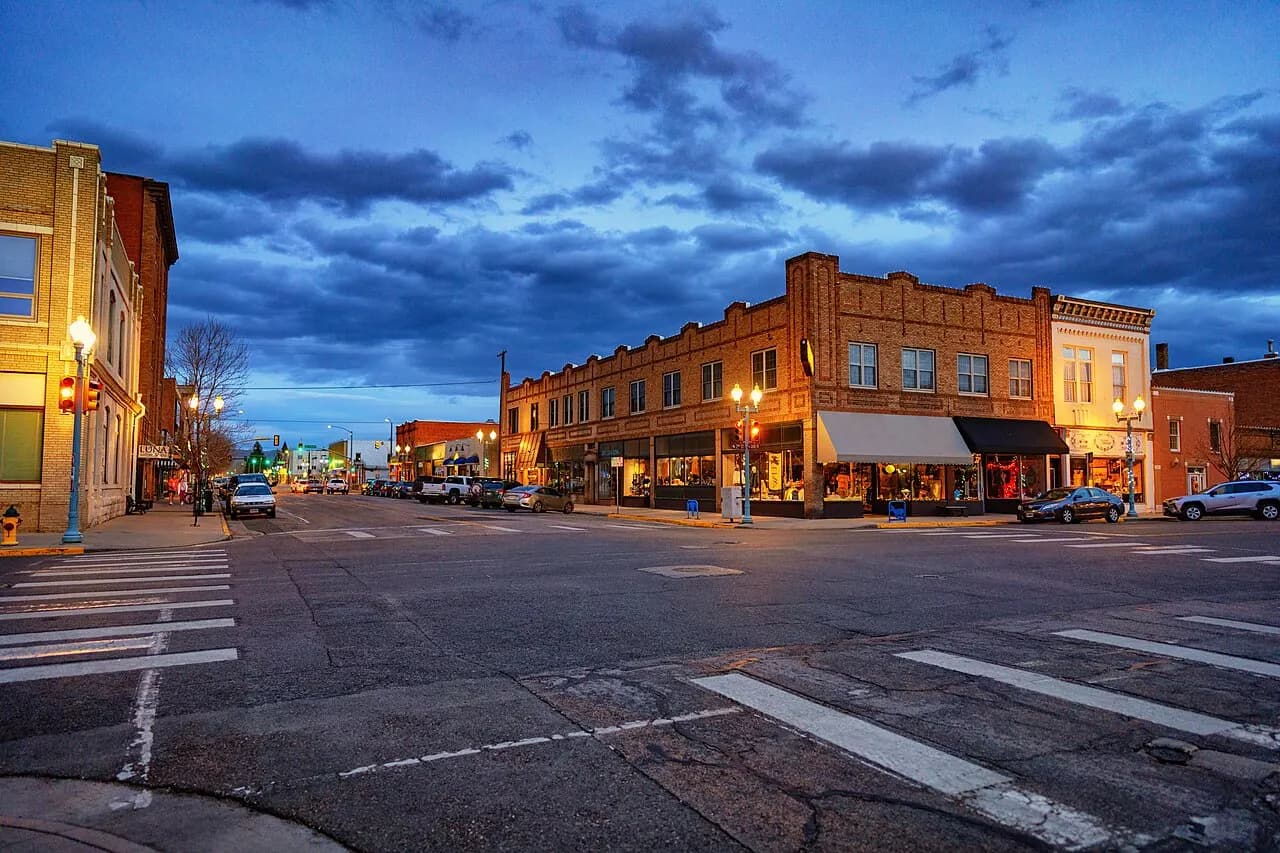 Brick storefronts at a downtown Laramie, Wyoming intersection at dusk